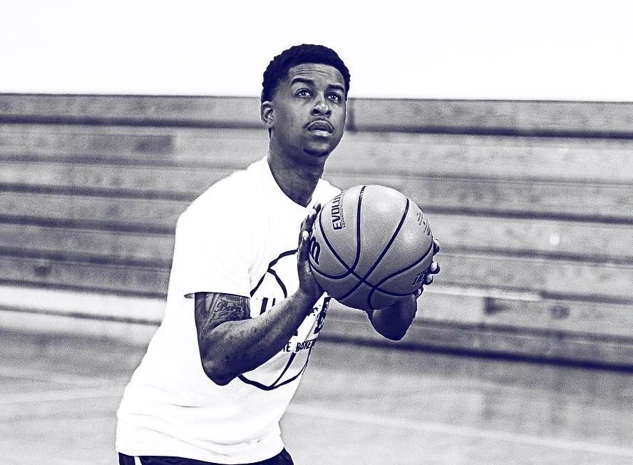Coach Howard shooting in the gym